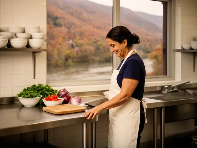 A woman with dark hair in a low bun beside new equipment in a small family Lebanese restaurant.